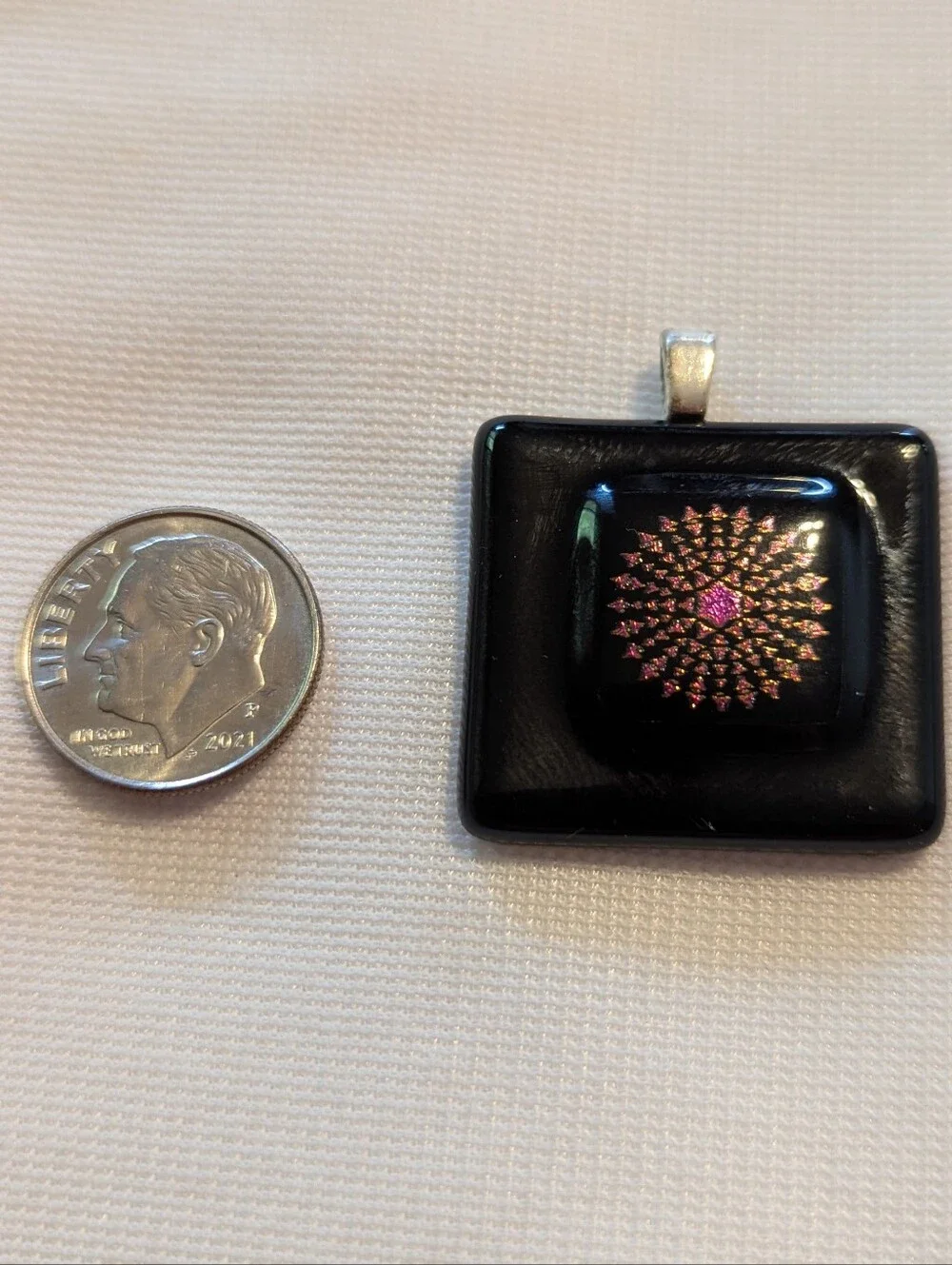 Black Pendant Featuring A Geometric Firework Pattern With Pink Center Handmade